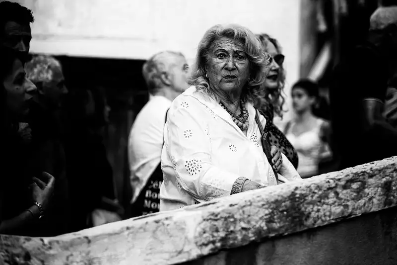 Captivating black and white portrait of an elegant elderly woman in Venice.
